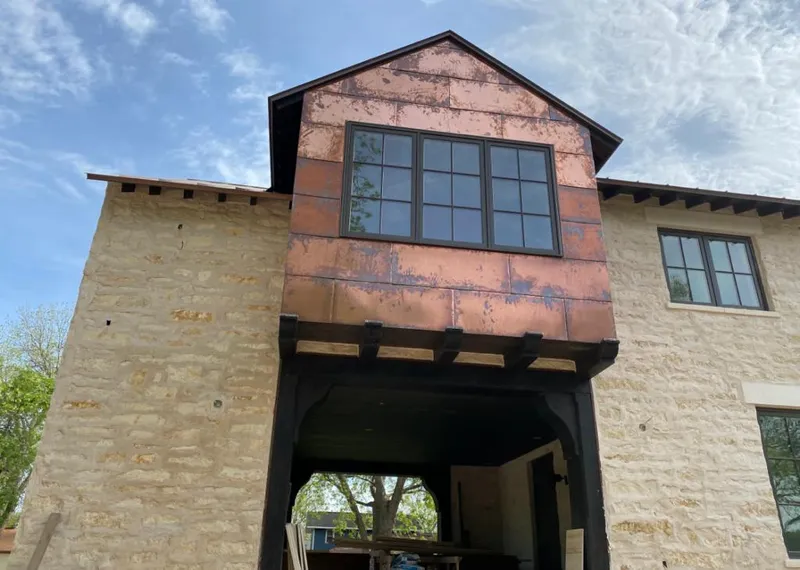Copper metal panel facade on a stone building for Skylight Installation in Sacramento