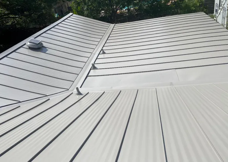 Solar attic fan installed on a metal roof for Roof Ventilation in Sacramento